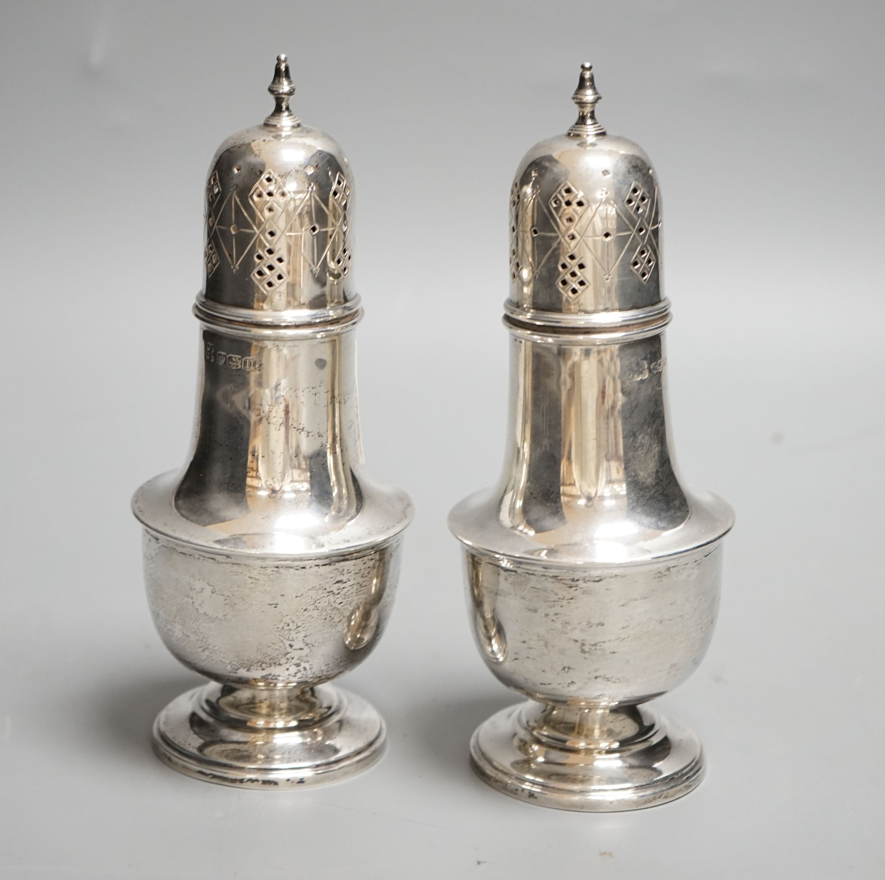 A pair of George VI silver sugar casters, William Batt & Sons, Sheffield, 1937, 17.7cm, 9oz.